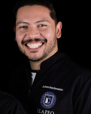 Dr. Bruno Hernández smiling